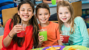 Three kids drinking cooldaddy's slushies 